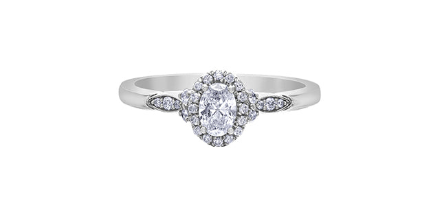 Diamond ring with a pear-shaped center stone on a white background