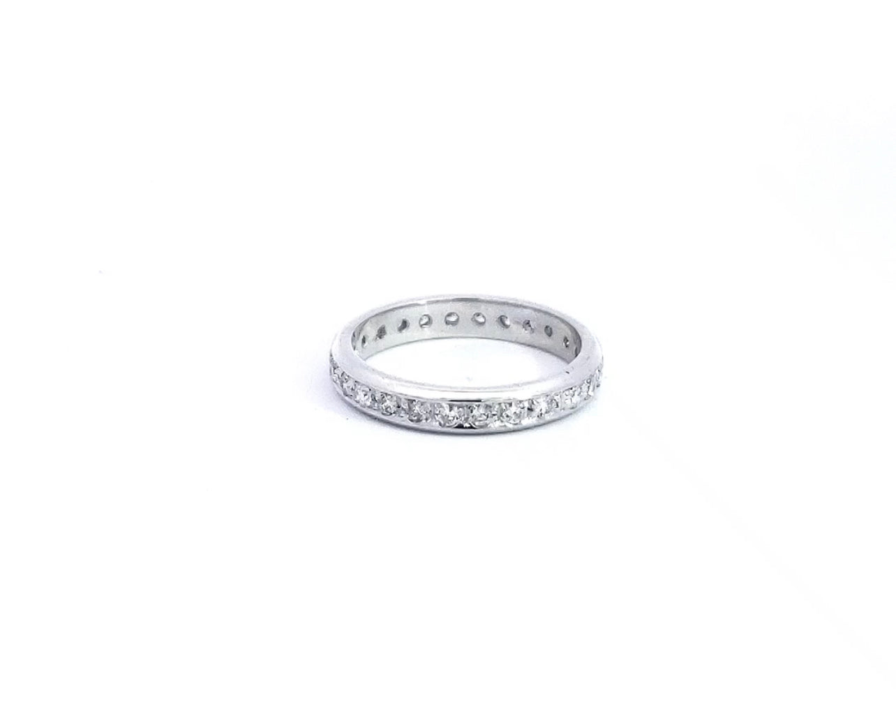 A 14K white gold eternity ring with multiple diamonds set around its circumference.