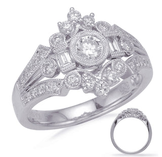 Elegant diamond ring with intricate design on a white background
