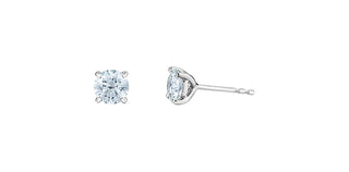 Two diamond stud earrings on a white background