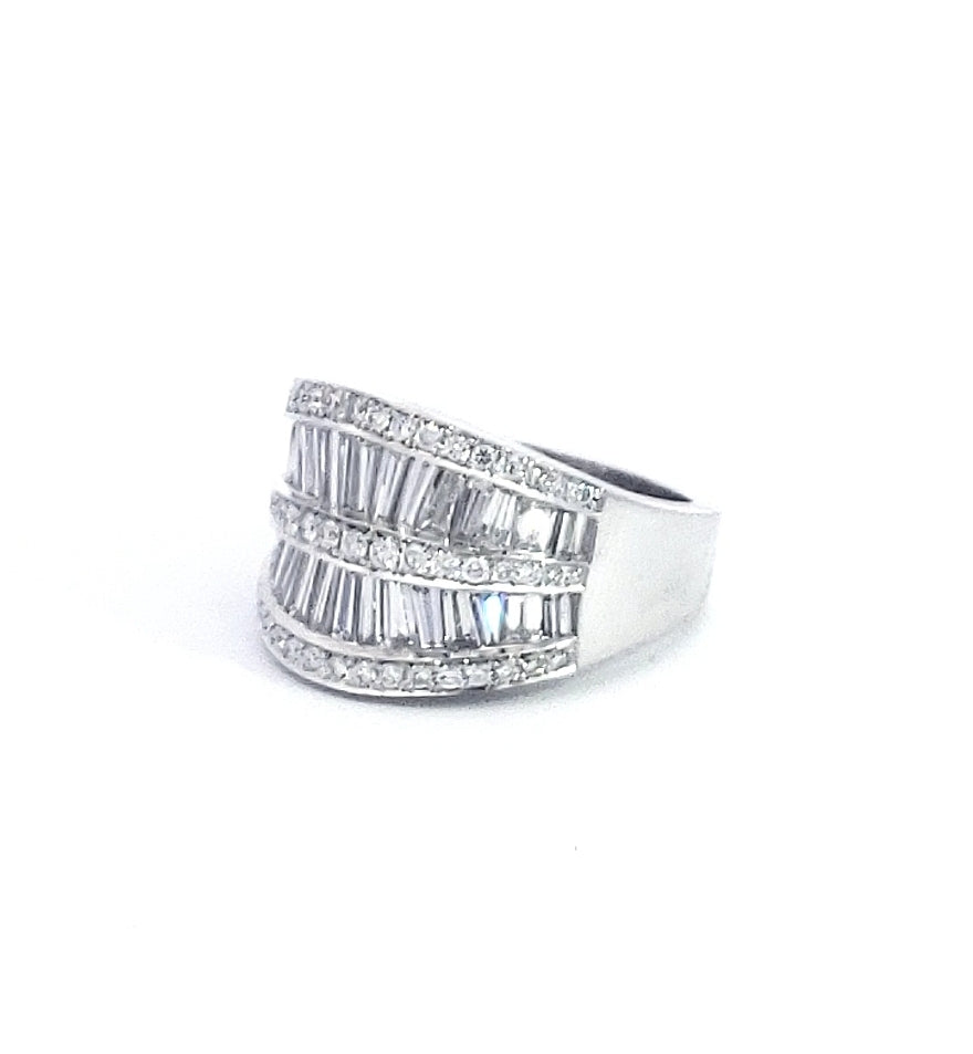 A 14K white gold ring with a 2.75cttw diamond round and baguette cut, size 6.5.