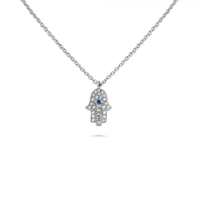 Silver hamsa hand necklace with a blue stone on a white background