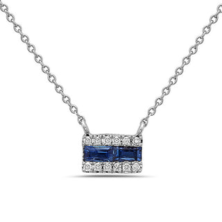 Silver necklace with a blue gemstone pendant on a white background
