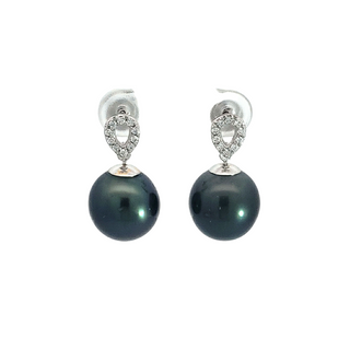 Pair of black pearl earrings with silver and diamond accents on a white background