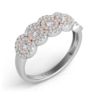 Silver ring with rose gold accents and diamonds on a white background