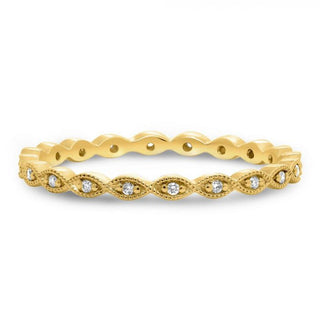 Gold ring with diamond accents on a white background