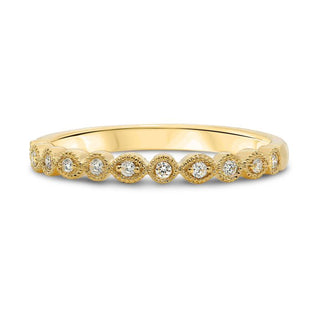 Gold ring with small diamonds on a white background