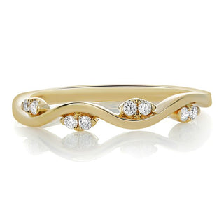 Gold ring with diamonds on a white background