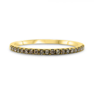 Gold ring with small diamonds on a white background