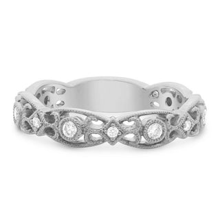 Silver ring with intricate design and small diamonds on a white background