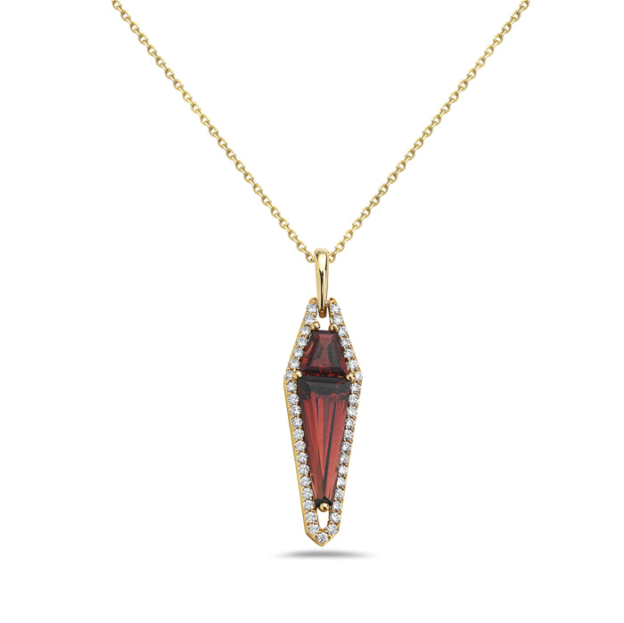 Gold necklace with a red gemstone pendant on a white background