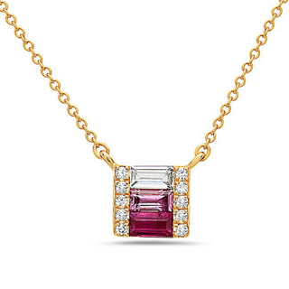 Gold necklace with a pink gemstone and diamonds on a white background