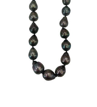 Necklace with dark pearls on a white background