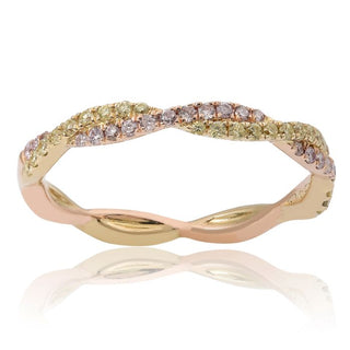 Gold ring with embedded diamonds on a white background