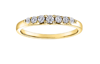 Gold ring with diamonds on a white background