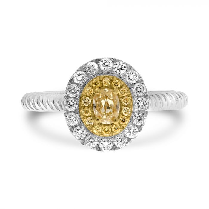 Ring with yellow gemstone and diamond halo on a white background