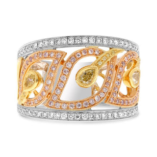 Gold and silver ring with gemstones on a white background