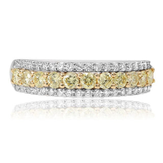 Diamond ring with yellow and white diamonds on a white background