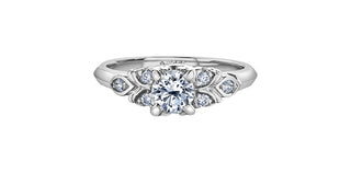 Diamond ring with a white gemstone on a white background