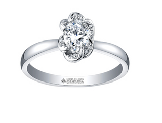 Silver ring with a floral diamond design on a white background