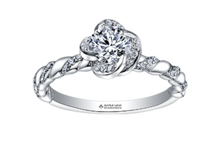 Silver ring with diamond design on a white background