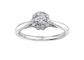 Diamond ring with a cluster design on a white background