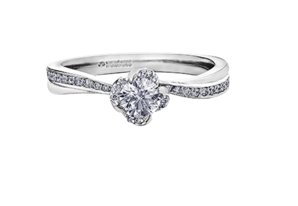 Silver ring with a diamond on a white background