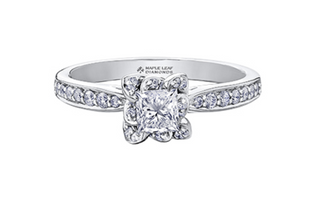 Diamond ring with 'Maple Leaf Diamonds' engraving on a white background