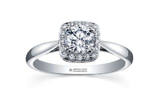 Diamond ring with 'Maple Leaf Diamonds' engraving on a white background