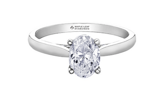 Diamond ring with 'Maple Leaf Diamonds' engraving on a white background