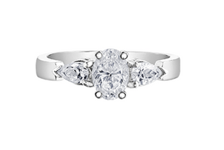 Diamond ring with three clear gemstones on a white background