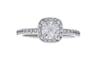 Diamond ring with a cushion-cut center stone on a white background