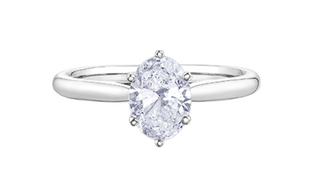 Silver ring with a pear-shaped diamond on a white background