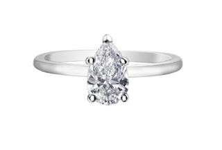 Diamond ring with pear-shaped gemstone on a white background