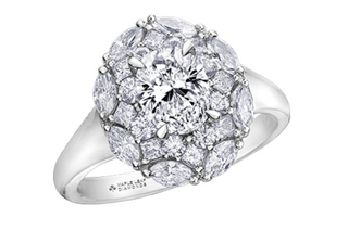Diamond ring with a prominent central gemstone and smaller stones on a white background
