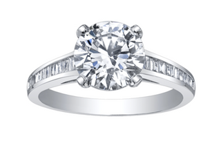 Diamond ring with a large central gemstone and smaller stones on the band against a white background