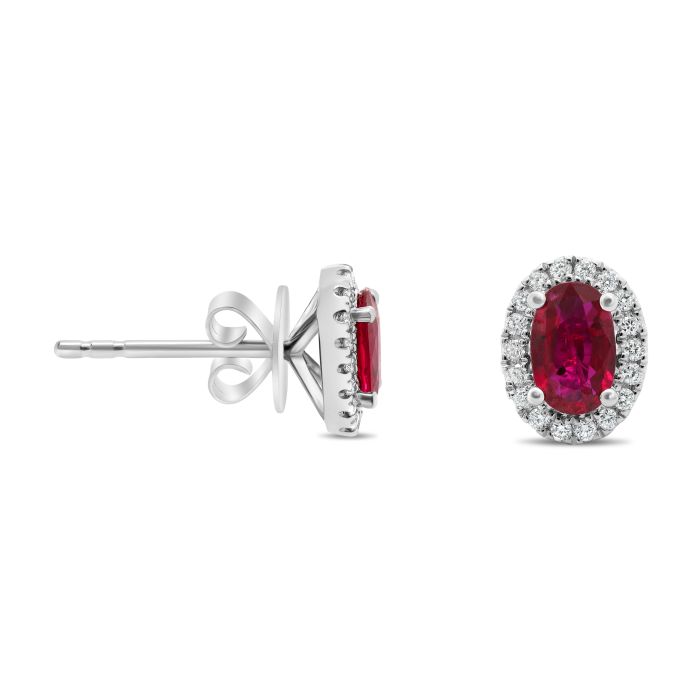 Ruby stud earrings with diamond halo on a white background
