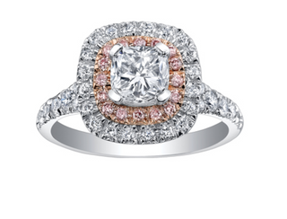 Diamond ring with a central gemstone and halo of smaller diamonds on a white background