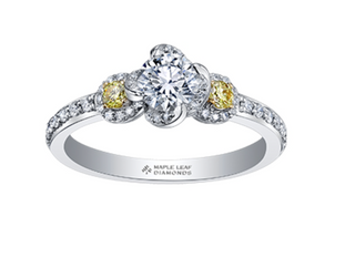 Diamond ring with yellow and white diamonds on a white background, featuring the Maple Leaf Diamonds logo.