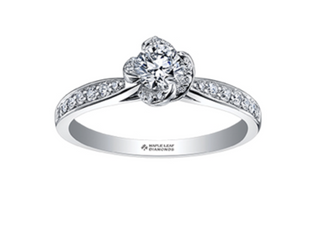 Diamond ring with a floral design on a white background