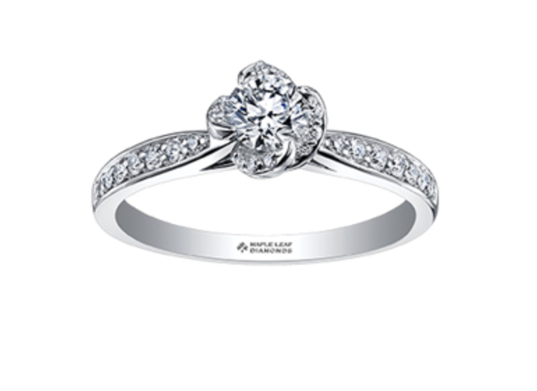 Diamond ring with a floral design on a white background