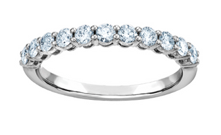 Silver ring with clear gemstones on a white background