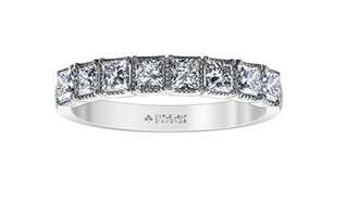 Diamond ring with 'Maple Leaf Diamonds' engraving on a white background