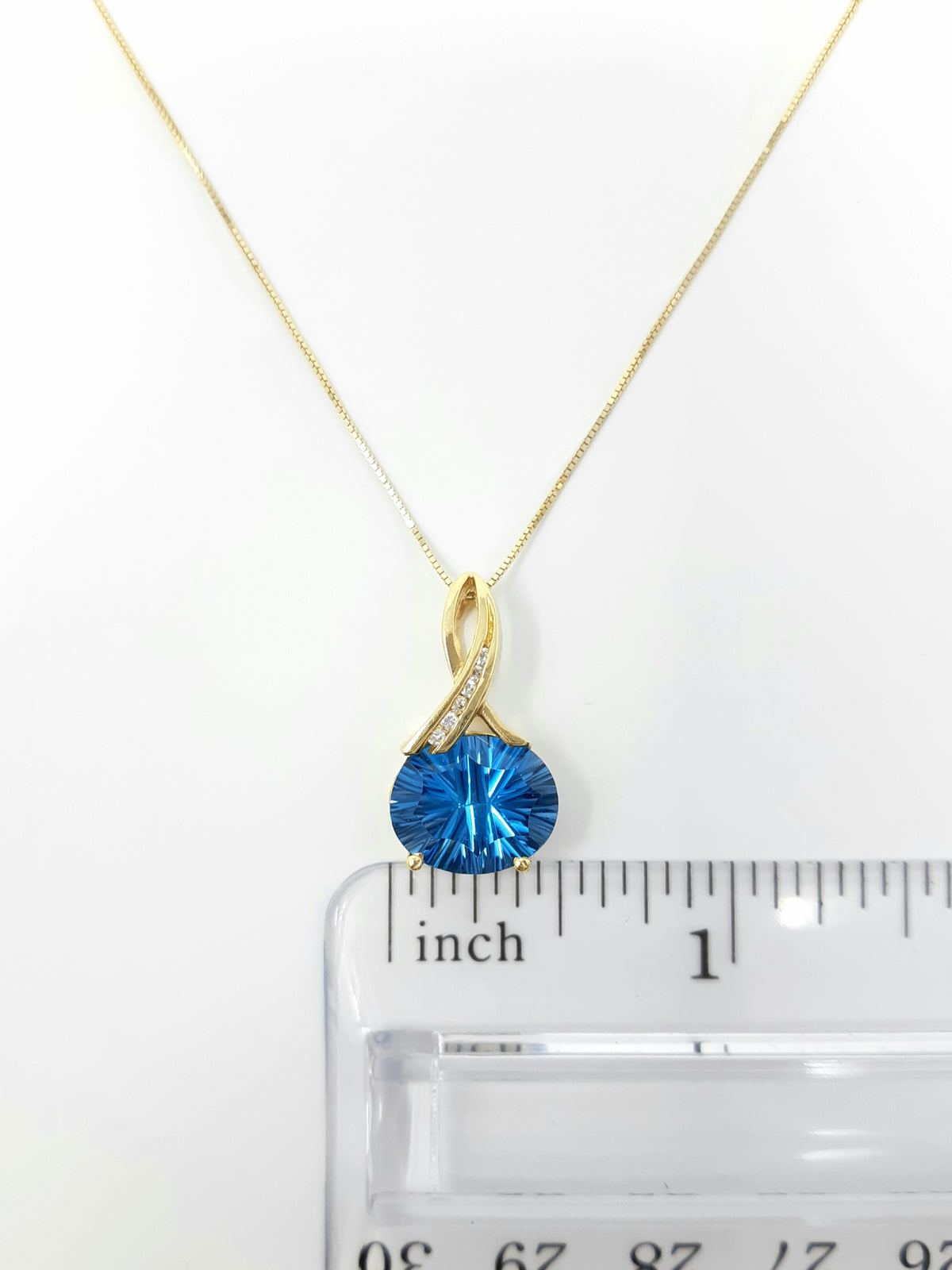 Blue Topaz and Diamond Pendant