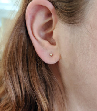 Aretes de diamantes en oro amarillo de 14 quilates