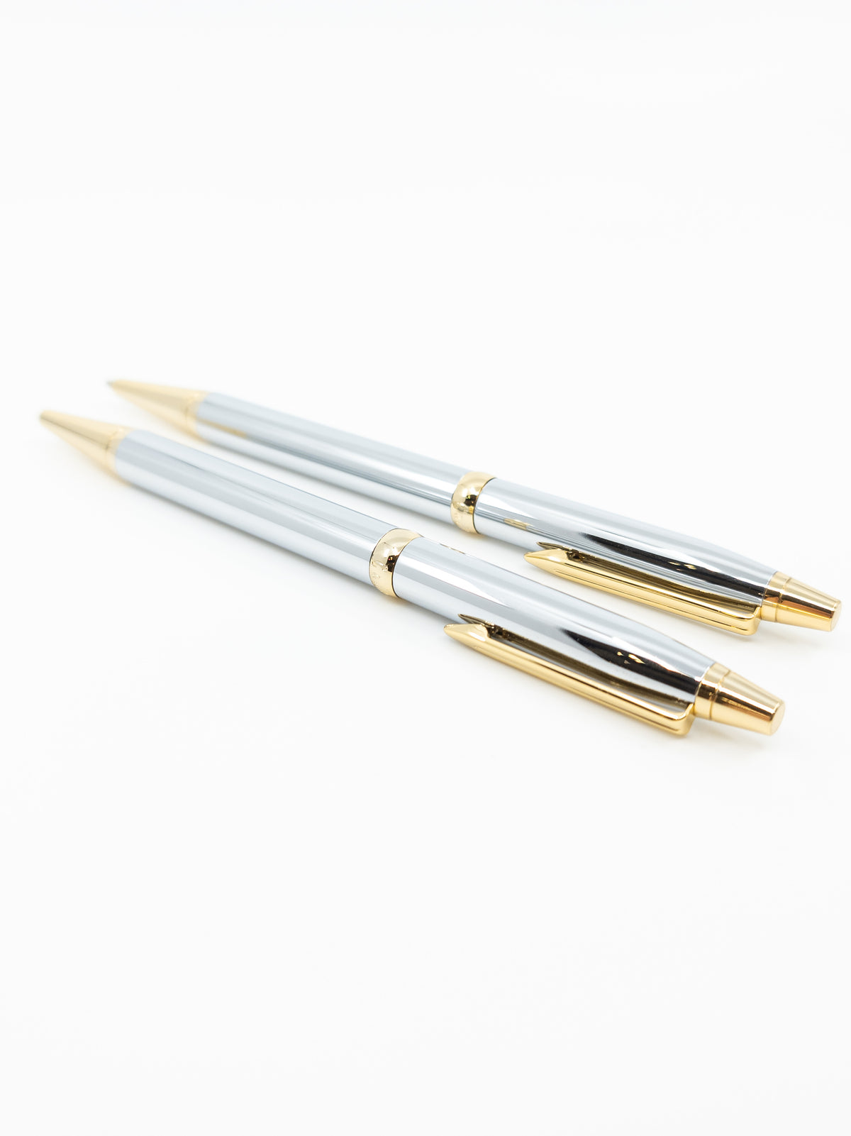 Juego de bolígrafos/lápices plateados y dorados
