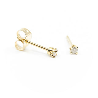 Aretes de diamantes en oro amarillo de 14 quilates
