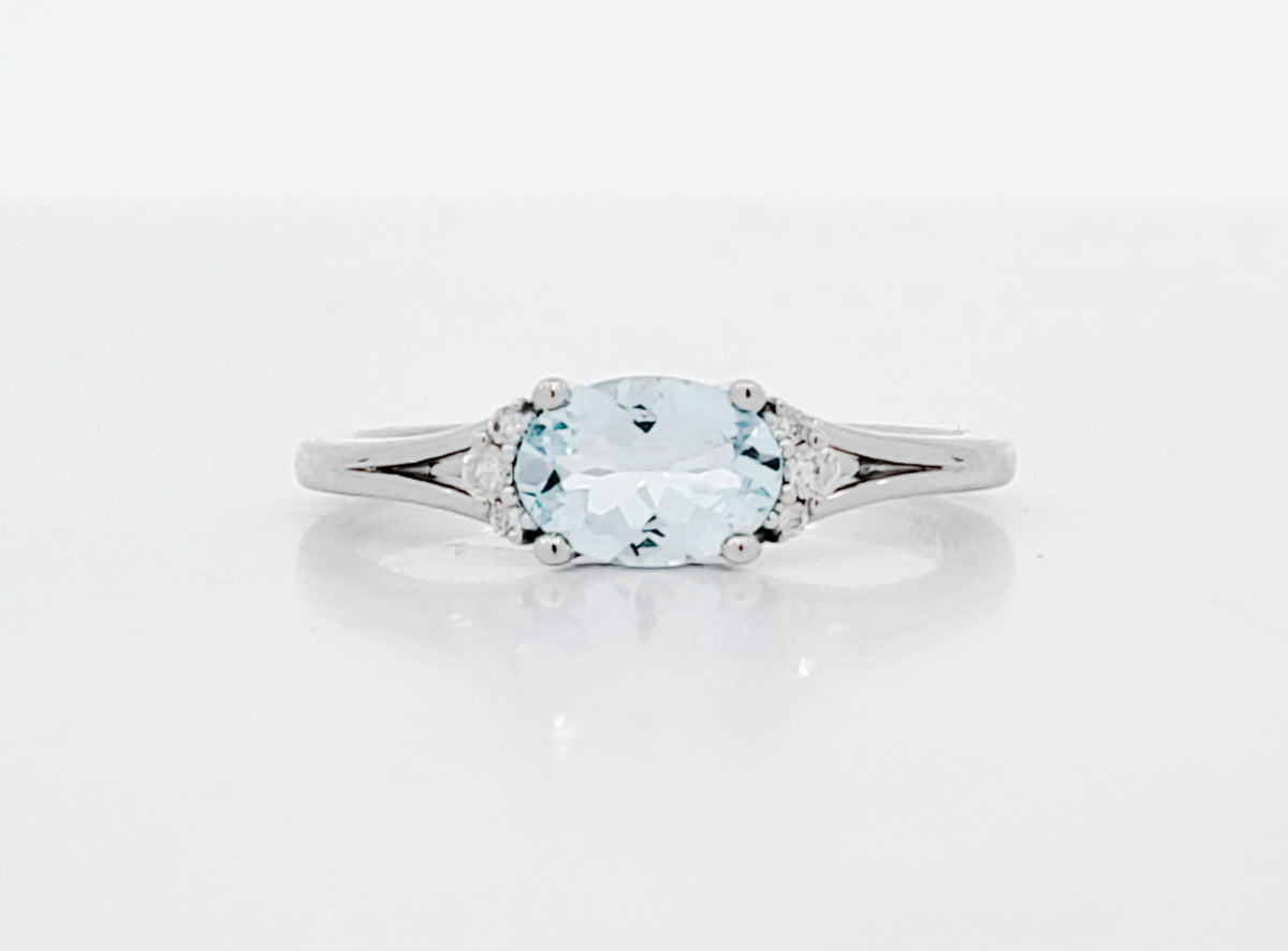 10K White Gold 5x7mm Oval Cut Aquamarine and 0.05cttw Diamond Ring, size 7