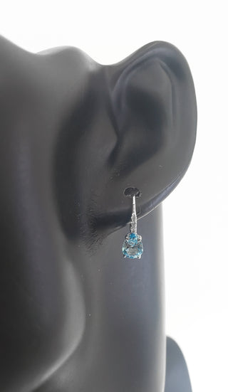10K White Gold 7x5mm Pear Cut Swiss Blue Topaz and 0.065cttw Diamond Dangle Earrings