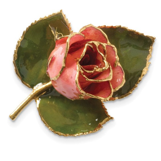 Decorative pink rose with gold accents on a white background